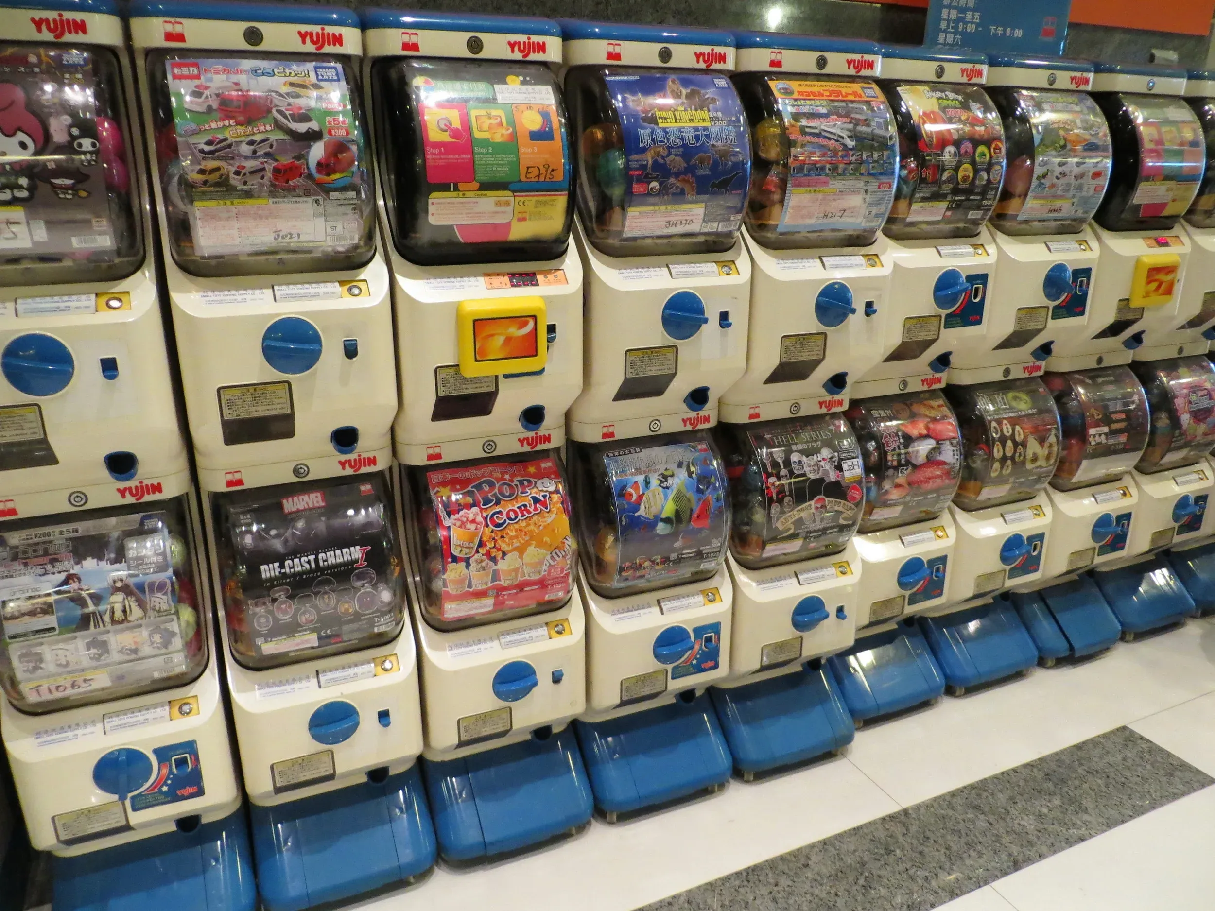A row of Gacha machines; each has a different theme or IP